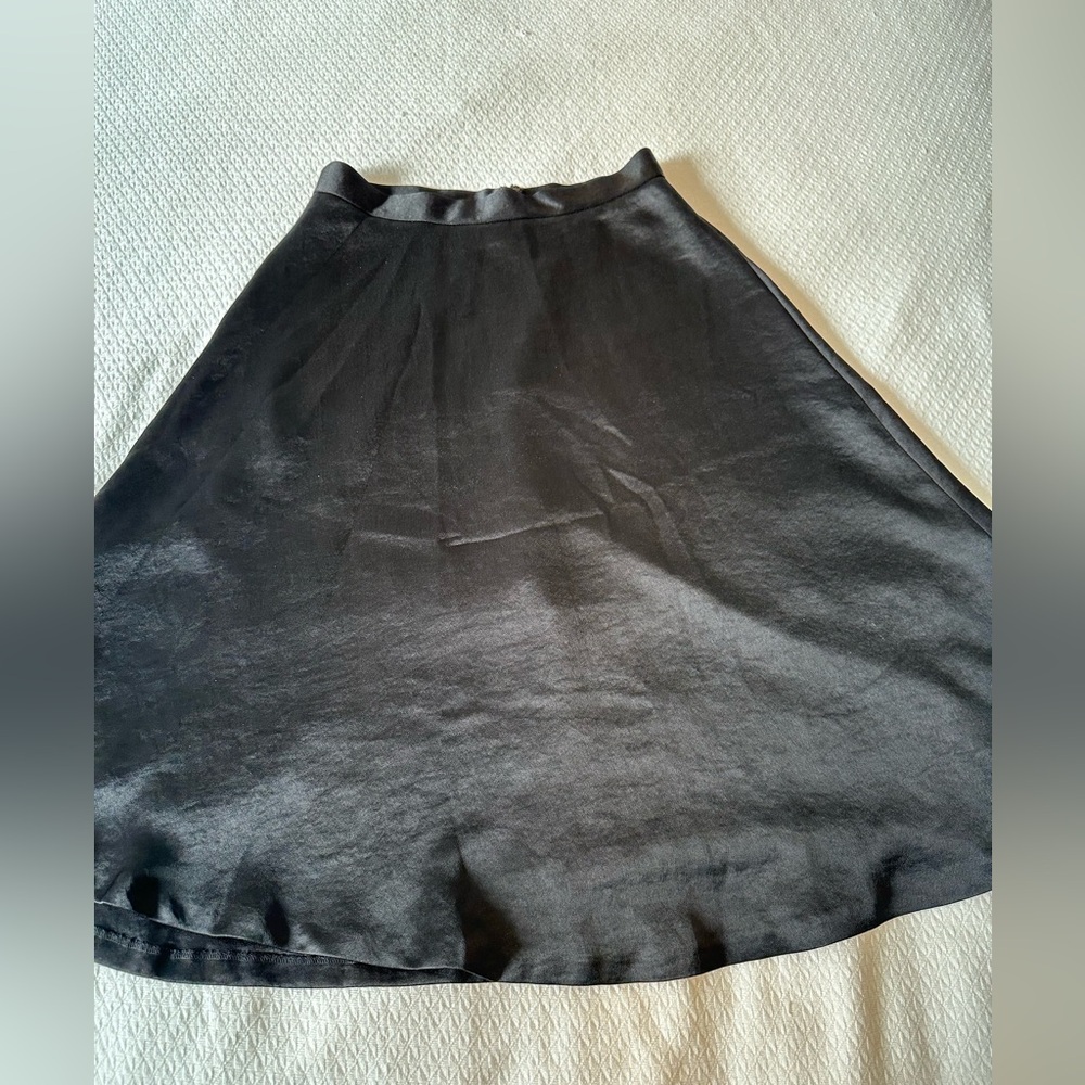 Beautiful Shimmery Black A-line Skirt (midi-length). NWT. Size 4.
